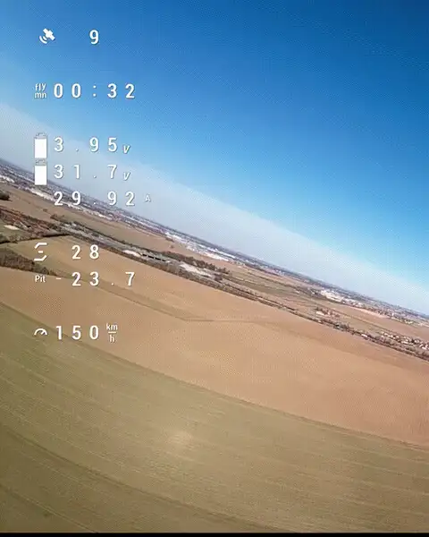 First-person view flight footage over farmland with on-screen flight telemetry